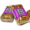Two Blind Date Bars purple label dates, sunflower seeds, pecans, almonds, coconut, honey, oatmeal. All Natural. No additives or preservatives.