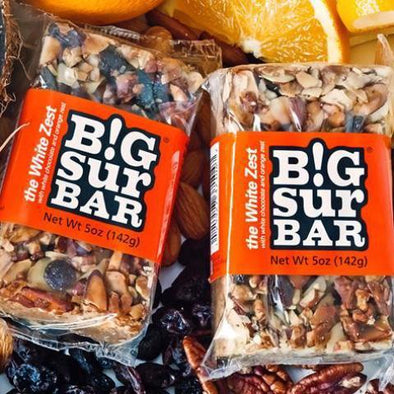 The White Zest Big Sur Bar, orange label, almonds, pecans, raisins, coconut, white chocolate, orange zest, honey, oatmeal. All Natural. No additives or preservatives.